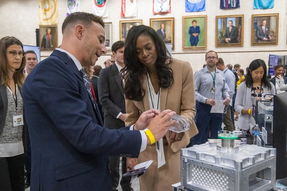A BREATHE team member demonstrating a device to a Health 250 attendee