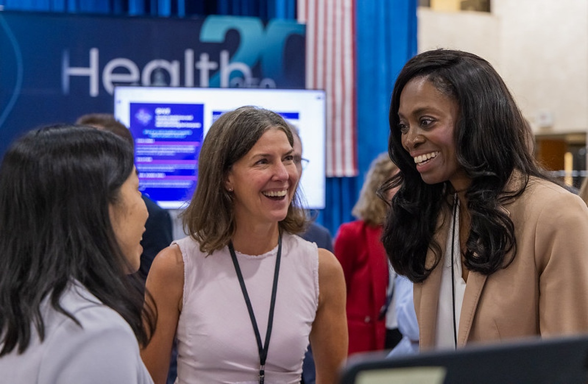 BREATHE team members in conversation at the demo floor
