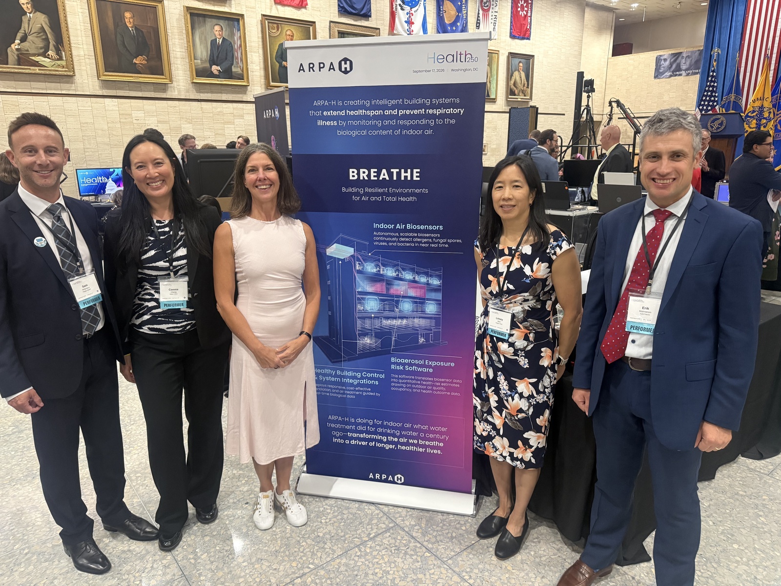 BREATHE team leads beside the ARPA-H BREATHE banner at Health 250